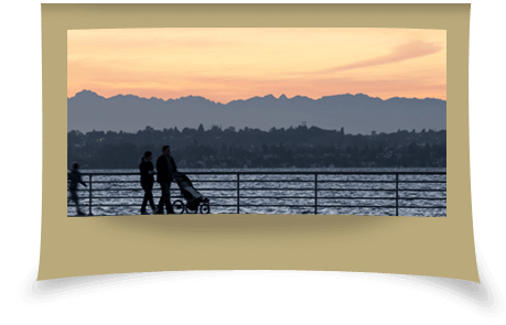 Family walking next to a lake